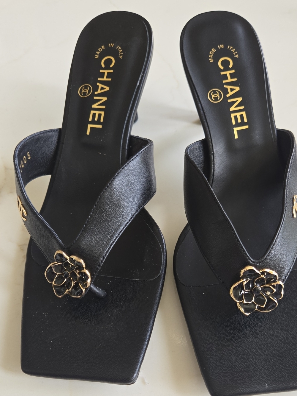CHANEL Black Leather Camellia Thong Sandals with Gold Flower Accents